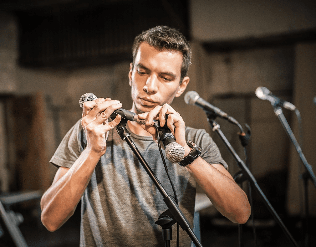 Golden West Sound Design Man Adjusting Microphone